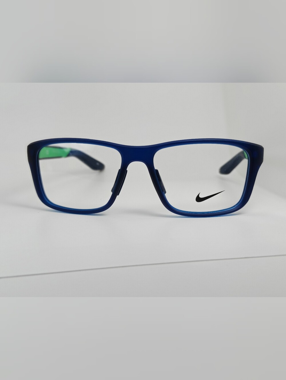 Nike Youth Navy Blue Rectangular Optical Frames with Green Temple Accents.
